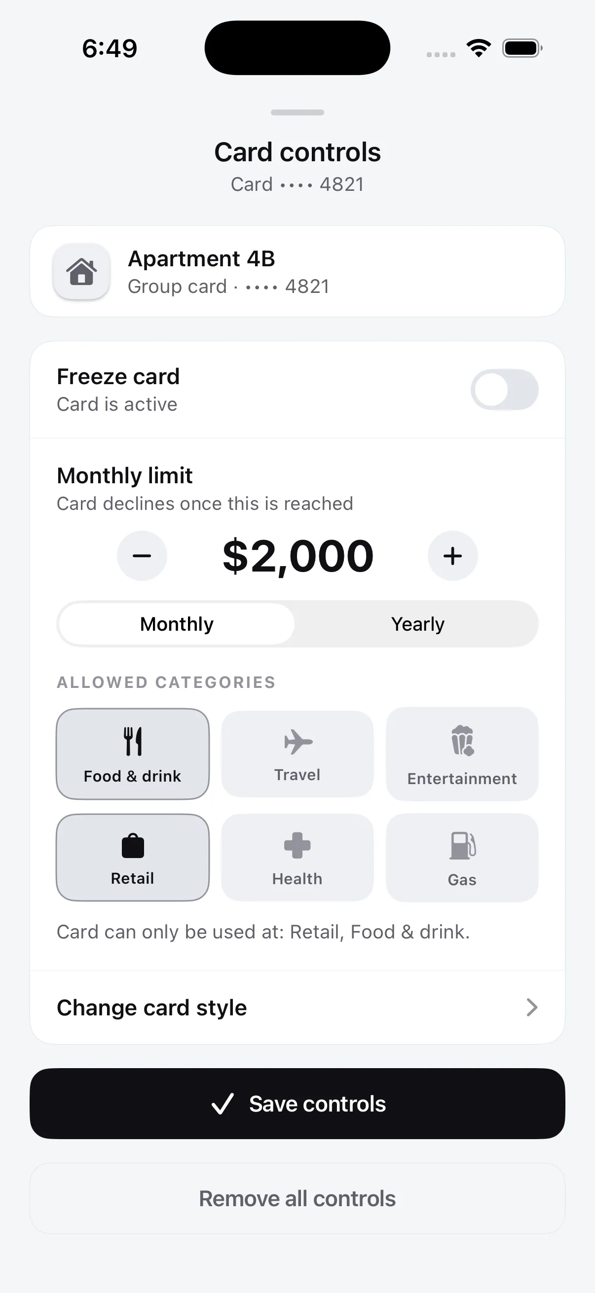 The Flint Card controls screen: the group card, a freeze toggle, a $2,000 monthly limit, and the categories the card is allowed at